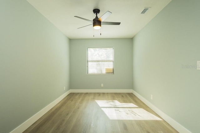 4230 Ponds Dr, Cocoa, FL 32927 - unfurnished room with baseboards, wood finished floors, and ceiling fan