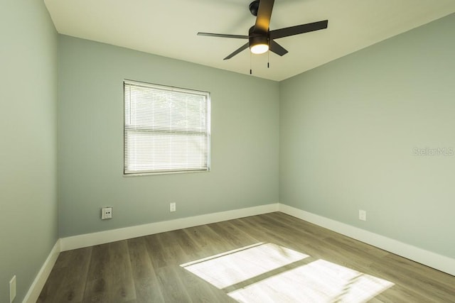 4230 Ponds Dr, Cocoa, FL 32927 - empty room with baseboards, ceiling fan, and wood finished floors