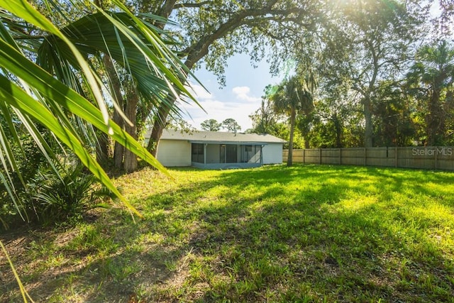 4230 Ponds Dr, Cocoa, FL 32927 - view of yard featuring a sunroom