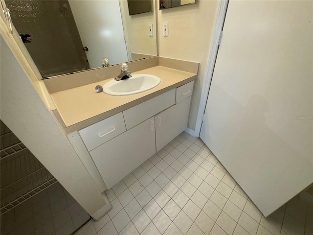 bathroom with tile patterned floors and vanity