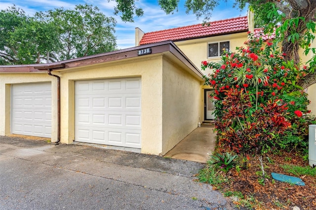 view of front of property with a garage