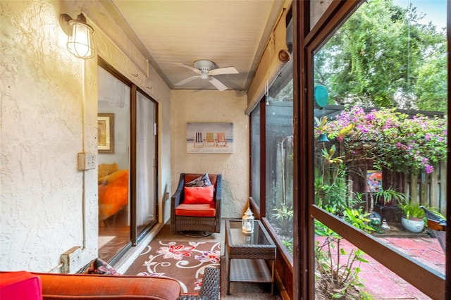 sunroom with a ceiling fan