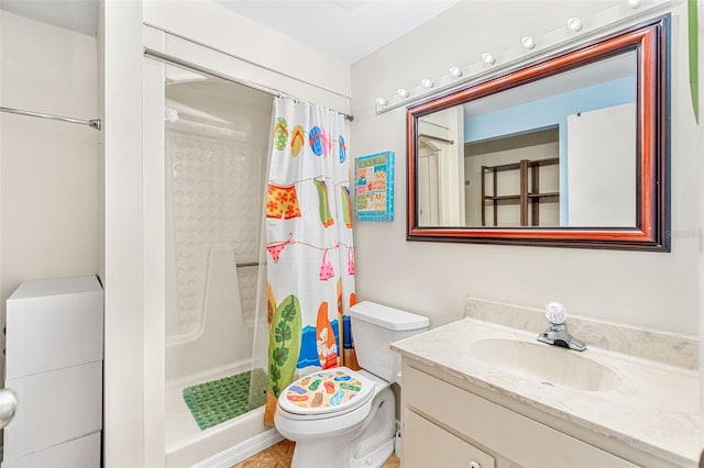 bathroom with toilet, vanity, and a shower with shower curtain