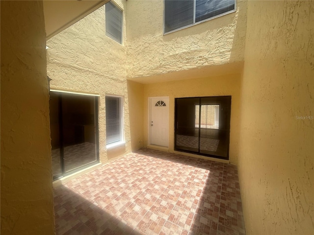 doorway to property featuring a patio