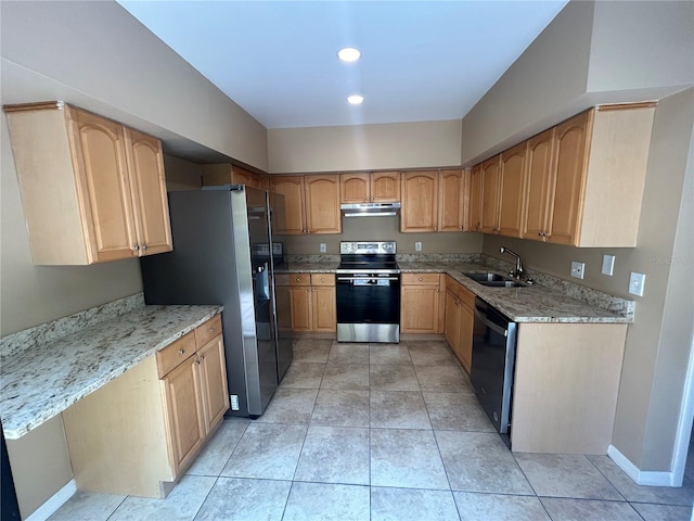 kitchen with light stone counters, appliances with stainless steel finishes, sink, and light tile floors