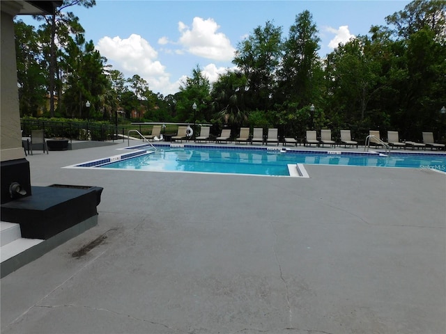 view of pool featuring a patio