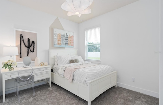 bedroom with dark carpet