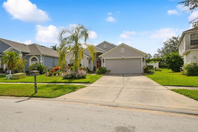 view of front of home with a front yard and a garage