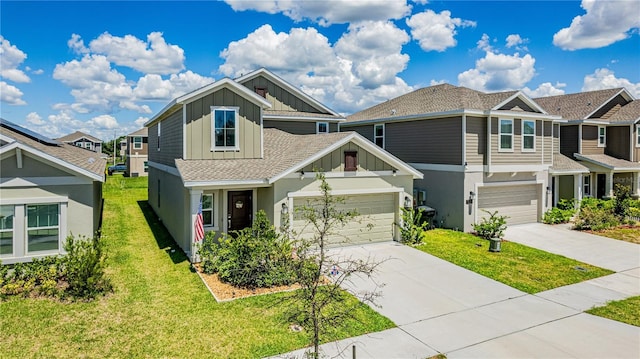 craftsman inspired home with a garage and a front lawn