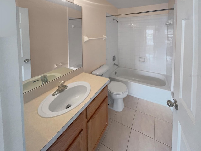 full bathroom with toilet, vanity, tile patterned floors, and tiled shower / bath