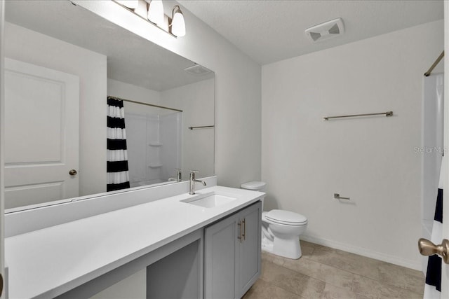 bathroom featuring tile flooring, vanity, and toilet