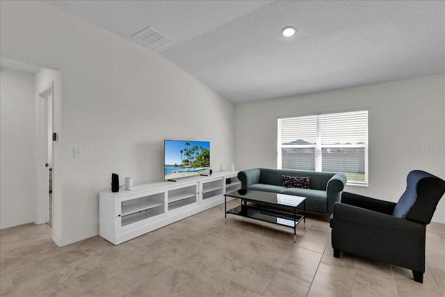 tiled living room with lofted ceiling