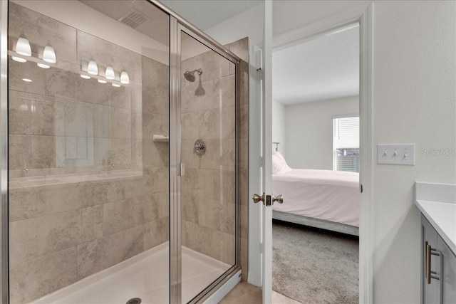 bathroom with an enclosed shower and vanity