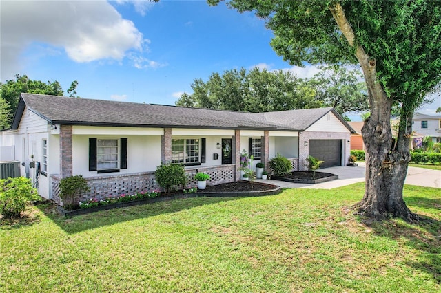 ranch-style home with a front lawn, a porch, and a garage