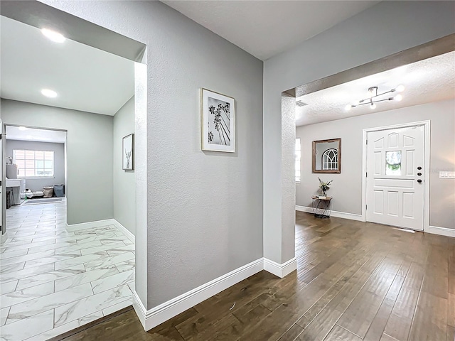 foyer entrance featuring hardwood / wood-style flooring