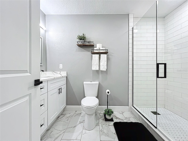 bathroom featuring a textured ceiling, vanity, toilet, and walk in shower