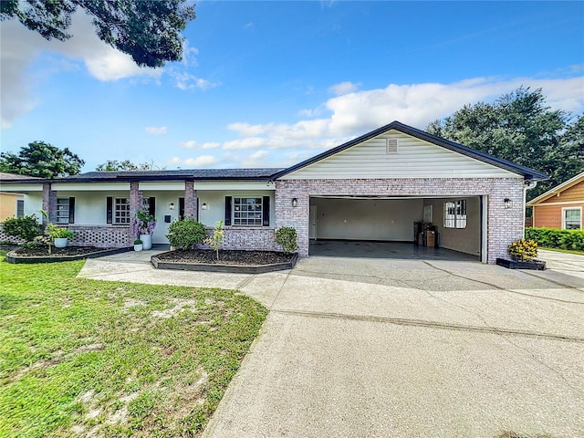 ranch-style house with a garage, covered porch, and a front lawn