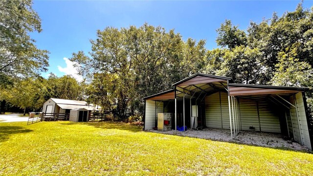 view of outbuilding featuring a yard