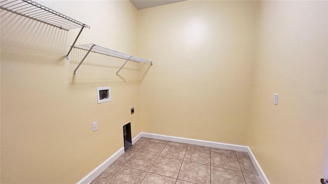 washroom featuring hookup for an electric dryer, hookup for a washing machine, and light tile patterned floors