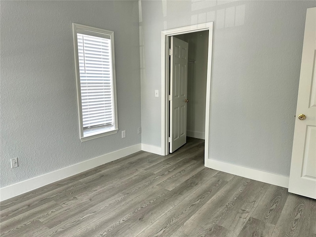 spare room with a healthy amount of sunlight and light hardwood / wood-style flooring