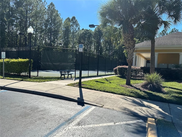 view of basketball court with tennis court