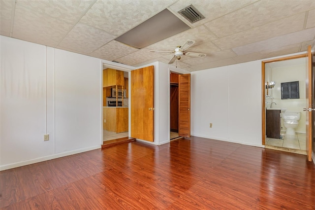 unfurnished room featuring ceiling fan and wood-type flooring