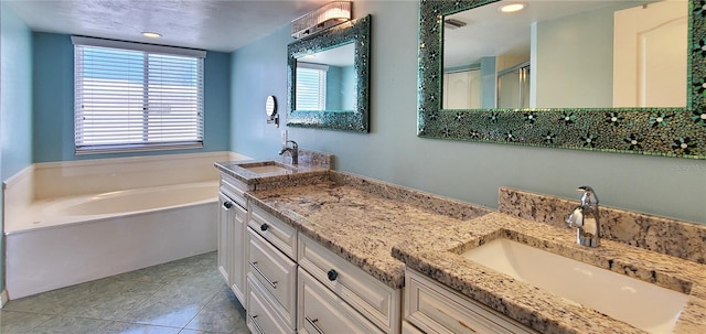 bathroom featuring tile patterned flooring, vanity, and shower with separate bathtub