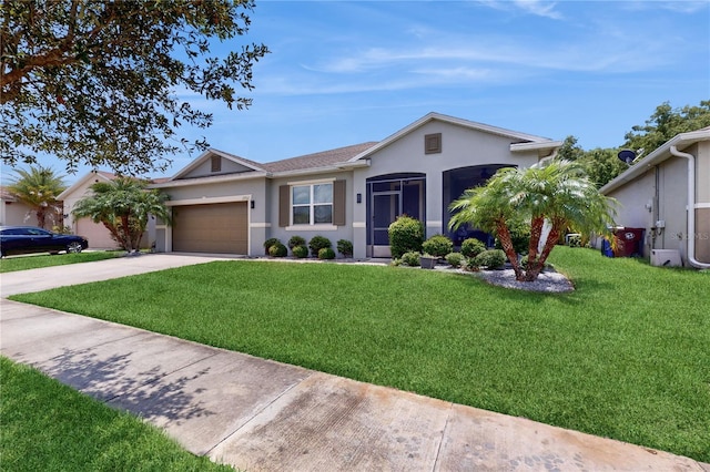 ranch-style house featuring a front yard and a garage