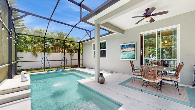 view of pool featuring a lanai, ceiling fan, and a patio