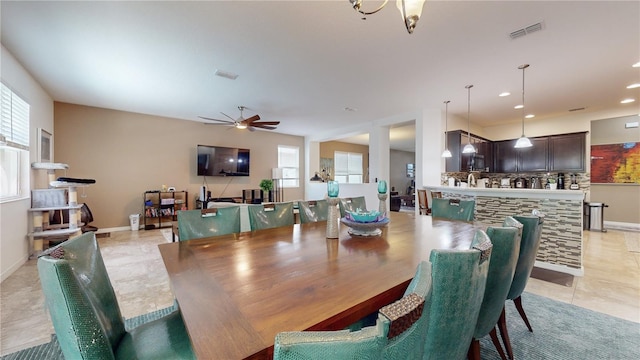 dining room with ceiling fan and light tile patterned floors