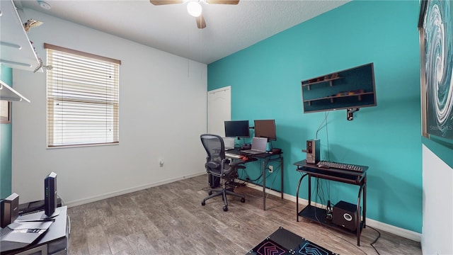 office space with wood-type flooring and ceiling fan