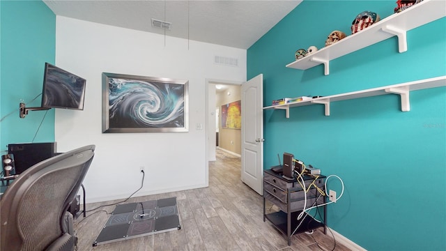 home office featuring hardwood / wood-style floors