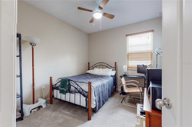 bedroom with ceiling fan and carpet floors