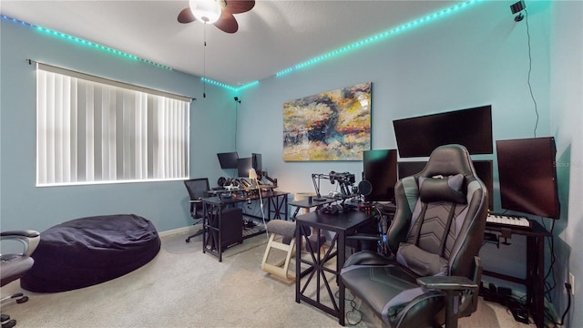 carpeted home office with ceiling fan