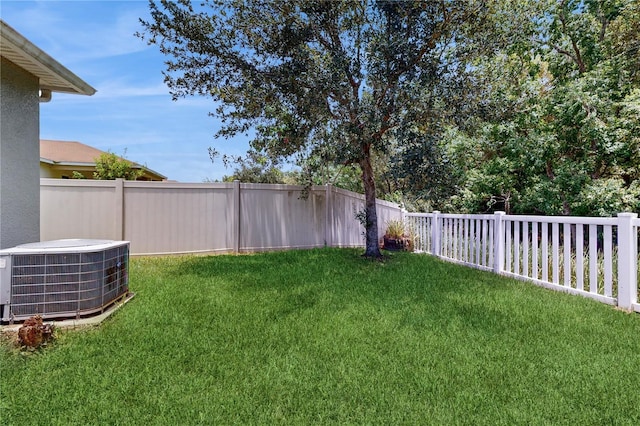 view of yard with central AC