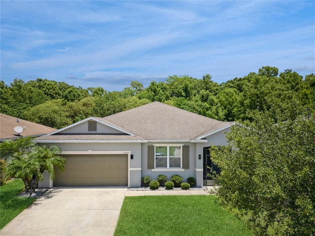 ranch-style house featuring a front yard and a garage