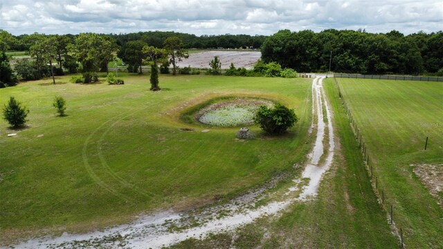 birds eye view of property with a rural view