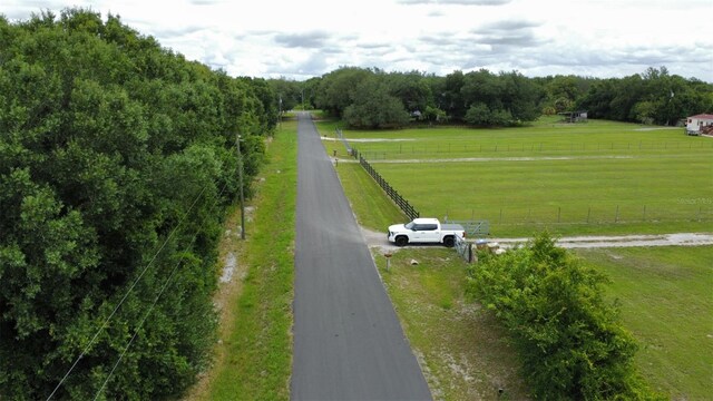 birds eye view of property with a rural view