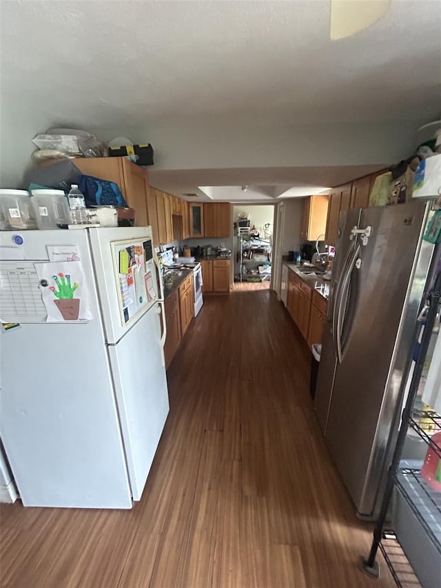 kitchen featuring dark hardwood / wood-style floors and appliances with stainless steel finishes