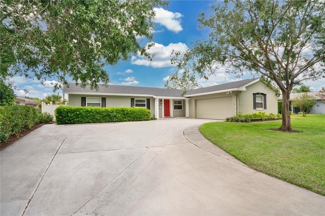 ranch-style home featuring a garage and a front lawn