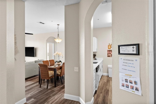 corridor featuring dark hardwood / wood-style flooring