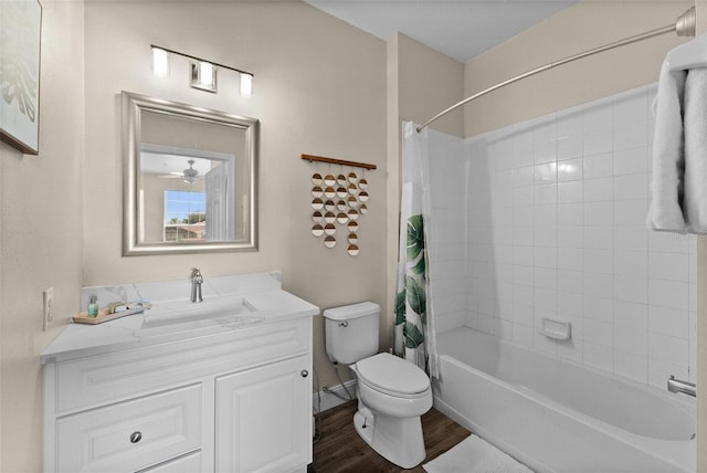 full bathroom with shower / bath combo, hardwood / wood-style floors, vanity, and toilet