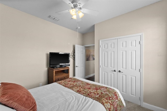 bedroom with carpet floors, a closet, and ceiling fan