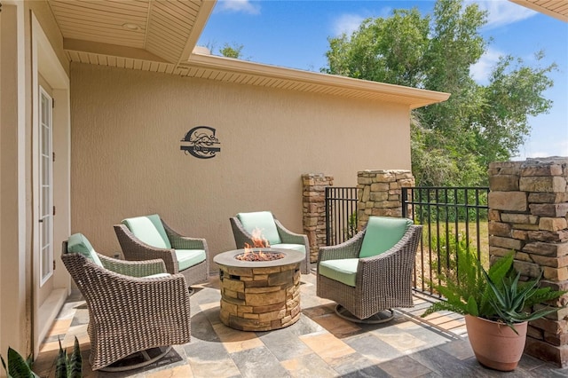 view of patio featuring a fire pit