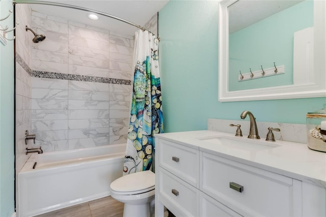 full bathroom with shower / bath combo, vanity, and toilet