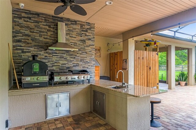 view of patio / terrace with area for grilling, ceiling fan, and sink