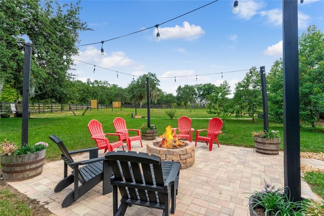 view of patio / terrace featuring an outdoor fire pit