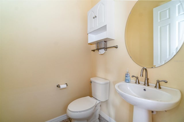 bathroom with sink and toilet