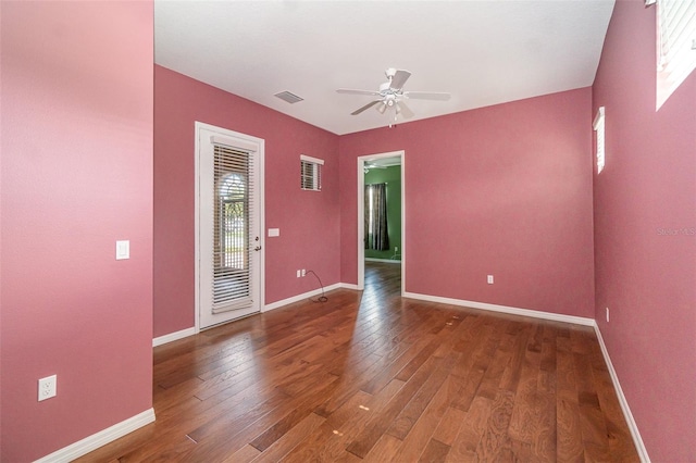 empty room featuring hardwood / wood-style flooring and ceiling fan