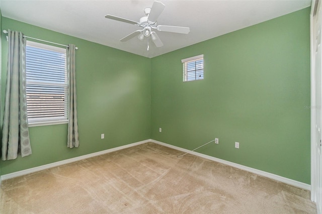 unfurnished room featuring light carpet and ceiling fan